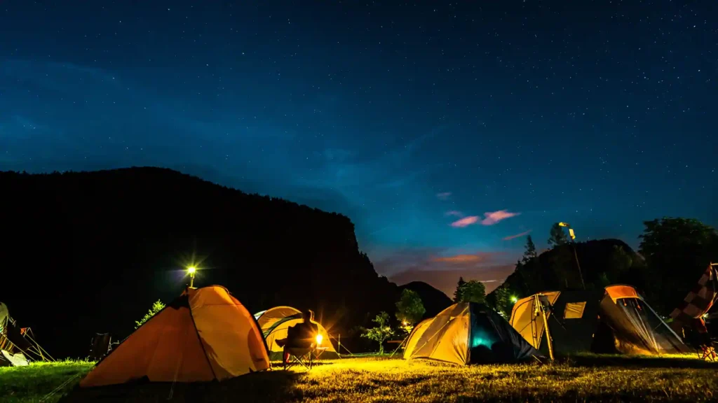 The Ultimate Guide to Summer Camp 3 tents under the clear sky at night